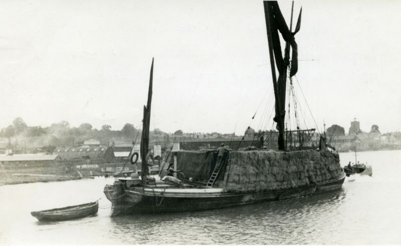  A latter-day stack barge, the VIOLET of Maldon, owned by Francis and Guilders of Colchester, towing down the Colne off Rowhedge in 1948. The hold and deck are filled with bales of straw bound for the paper mill at Ridham Dock, on the Swale in Kent during the short revival of the stack trade. Photo Roger Finch.

Used in Barges Page 67, source not given. 
Cat1 Places-->Colne Cat2 Barges-->Pictures
