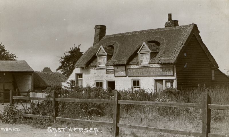 Click to Pause Slide Show


 East Mersea Dog and Pheasant, before the new part was added to the front in the 1920s. The sign on the front says C. & W. R. Seabrook's Fine Pale & Mild Ales & Porter. Another copy of this postcard was mailed 1915.

Postcard 78460. 
Cat1 Mersea-->Pubs Cat2 Mersea-->East