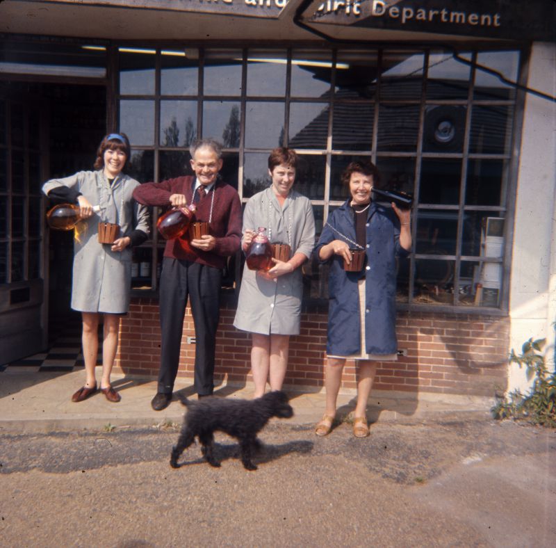  Outside the off license, Howards Stores, Church Road.

Carol Dixon, Percy Bacon, Dilys Overbury née Maylor, Bessie Dixon [Mum].



We are all holding flagons of Coates cider except Mum who appears to have a bottle of wine. The small 'buckets' we are holding were actually flower-pot holders which had chains attached, these had been adapted to hang round the barrels that held ...
Cat1 Mersea-->Shops & Businesses Cat2 People-->Other