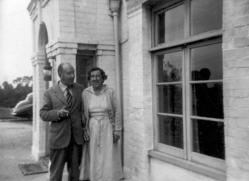  Gwendoline and Edward Harding outside their home - Strood Close, The Strood, Peldon. They named the house Strood Close. They had bought the house from cartoonist Leslie Grimes 1948/49. When they sold it in 1969, it was to the Church of England, and the house became The Vicarage, Peldon 2 or 3 years. The Tate family later named the house Pyefleet House. 
Cat1 Mersea-->Buildings Cat2 People-->Other Cat3 Places-->Peldon-->Buildings Cat4 Places-->Peldon-->People