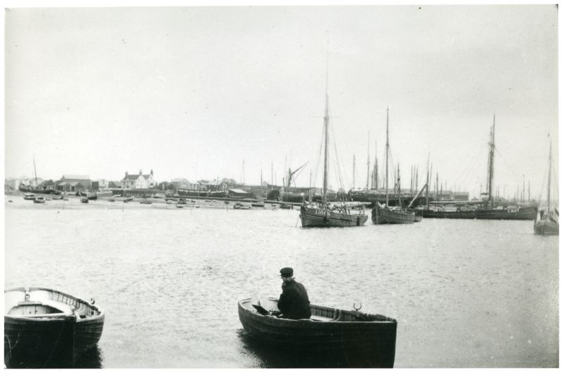  Brightlingsea from St. Osyth Stone about 1885. First class cutter smacks and a ketch in the creek. Others crowd the hard where the coastguard hulk lies just below the old Anchor Inn. Large yachts hauled up in Aldous yard.

Smacks 130CK and CK27

Used in The Northseamen Page 55. 
Cat1 Places-->Brightlingsea Cat2 Smacks and Bawleys