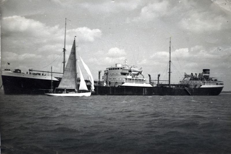 NEWCOMBIA laid up in River Blackwater. Yawl THALASSA in foreground. Date: c1959.