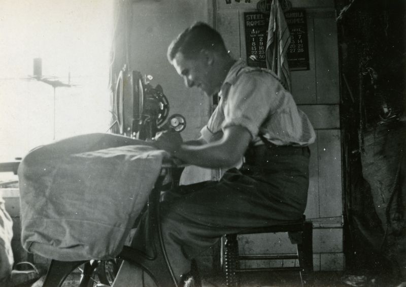  Gowens sailmakers. Ernie Ponder. The calendar in the background is for August 1937. 
Cat1 Ship and boat building, sailmaking Cat2 People-->Other