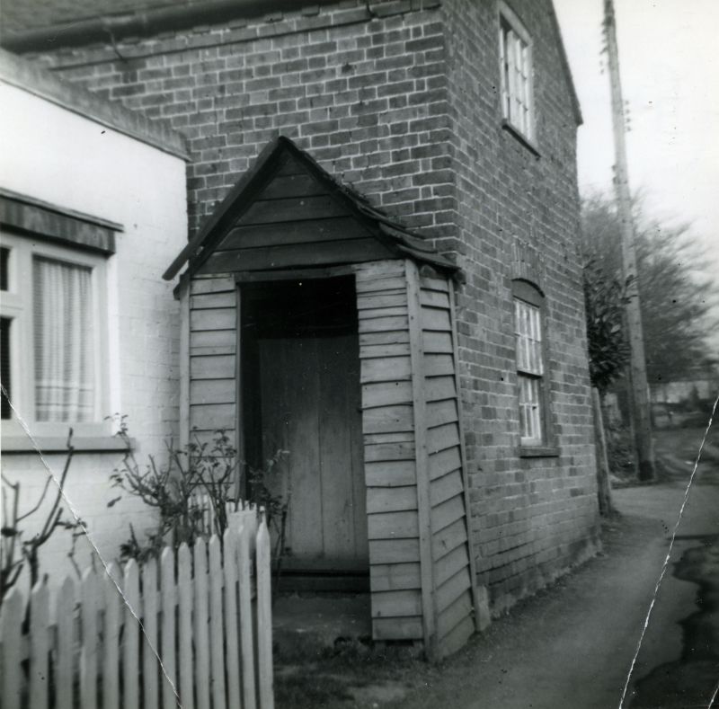  Grandmother Southgate's cottage onthe left. Mrs Cundy's cottage first door. The Lane. March 1961, just before Cundy's cottage was demolished.

Now Curlew Cottage. [all notes from the back of the photograph]. 
Cat1 Mersea-->Buildings Cat2 Mersea-->Old City & the Hard