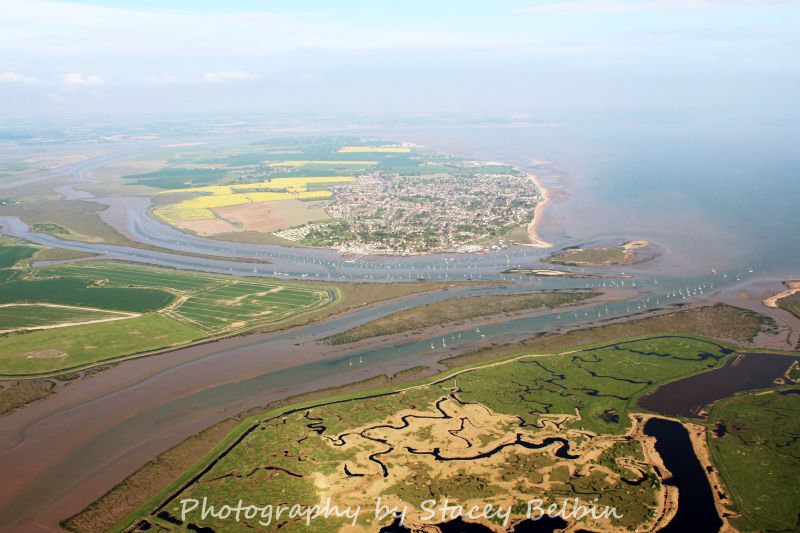  View east from Old Hall Marshes to Mersea Island. Salcott Creek is on the left with Sunken Island in the centre.

Part of a collection of aerial views of Mersea taken by Stacey Belbin. If you are interested in purchasing any of these photographs, please contact Stacey at ladygraceboat.trips @ gmail.com 
Cat1 Aerial Views-->Mersea Cat2 Mersea-->Creeks, fleets, channels, saltings