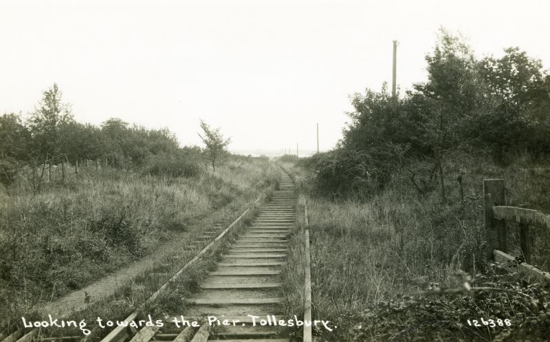  Railway - Looking towards the Pier, Tollesbury. Postcard 126388, not mailed. 
Cat1 Tollesbury-->Transport Cat2 Transport - buses and carriers