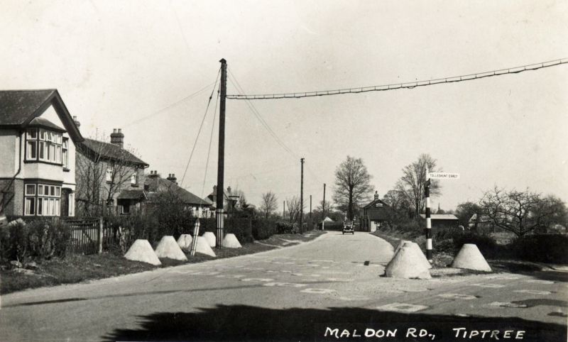  Maldon Road, Tiptree. Junction with Station Road. WW2 Anti-invasion barriers beside the road. 
Cat1 Places-->Tiptree Cat2 War-->World War 2