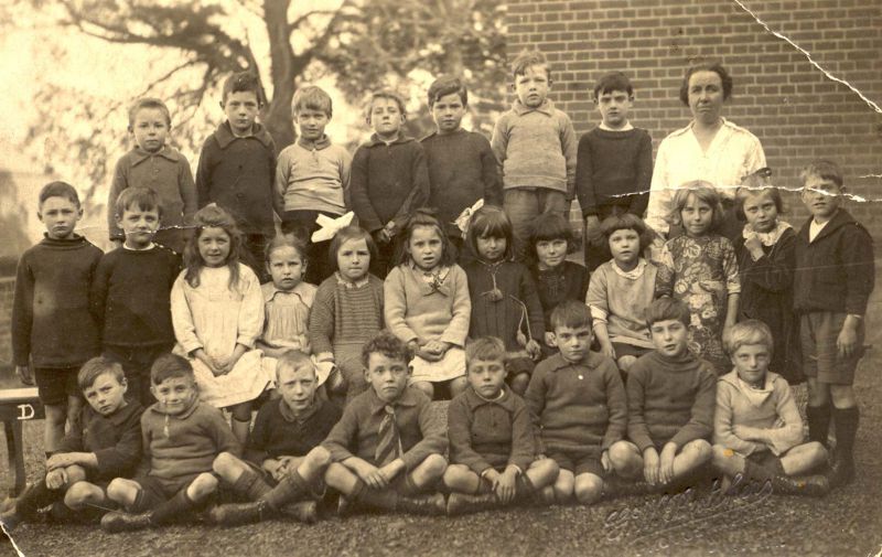  West Mersea School group.

Back row 1. Maurice Jay, 2. George Humm, 3. 'Cromer' Russell (Salmon), 4. ?, 5. Jack Hoy, 6. Jeff (Joss) Green, 7. Alfie (Alfred) Butler, 8. Miss Minnie Mole.

Centre 1. Lennie Leggett, 2. Eddie (Edward) Butler, 3. Gladys Green (Swiggs), 4. Joan Mole Boon), 5. Margaret 'Bubba' Brown, 6., 7. Gladys Hempstead, 8. ? Harmer, 9. ? Harmer, 10. Freda Cole, 11. Mary ...
Cat1 Mersea-->Schools-->Pictures Cat2 People-->School