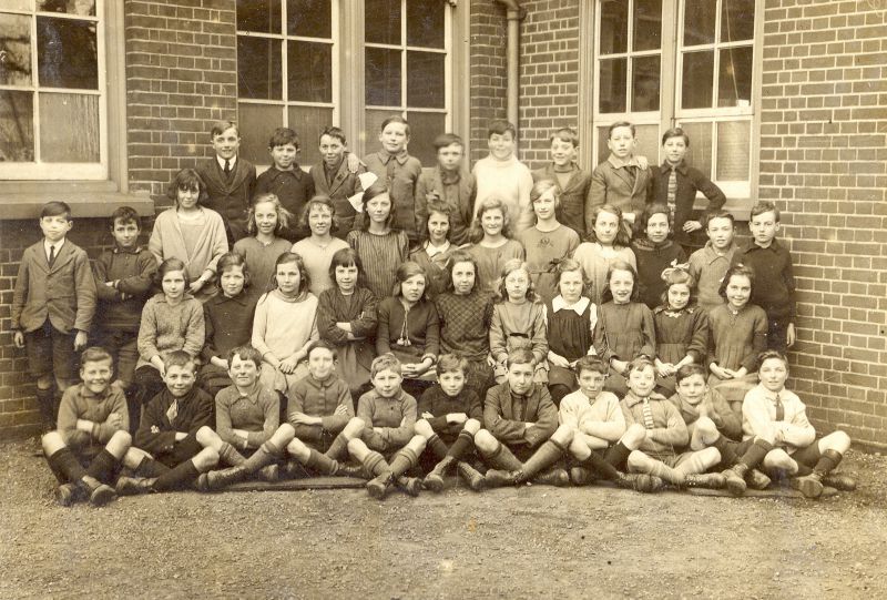  West Mersea School

Back row L-R 1. Nathan Smith, 2. Reg Hempstead, 3. Ron Thursby, 4. Jack Cudmore, 5. Tom Sales, 6. Charles 'Tiddler' Mole, 7. Fred Wass, 8. Bernard Cudmore, 9. Wilfred Carter

Second Row 10. Oswald Pullen, 11. John Milgate, 12. Blanche Crowder, 13. Sybil Farthing, 14. Grace Milgate, 15. Emmy Farthing, 16. Louise Cook, 17. Violet Dimmock, 18. Winnie Farrow, 19. Amelia ...
Cat1 Families-->Farthing Cat2 Families-->Hewes Cat3 Families-->Mole Cat4 Families-->French