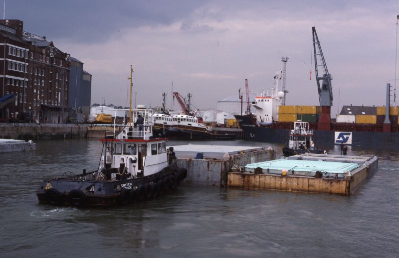  Lighter aboard ship (LASH) vessels. GRAY DELTA (left) and GRAY ECHO towing lighters into Felixstowe Dock. In the background are the tugs CROSBY and ALFRED, and on the right, the SLOMAN ROVER.

35mm slide processed 10/88, via Don Wright, SSBR 
Cat1 Ships and Boats-->Merchant -->Power Cat2 Places-->Harwich Cat3 Ships and Boats-->Tugs