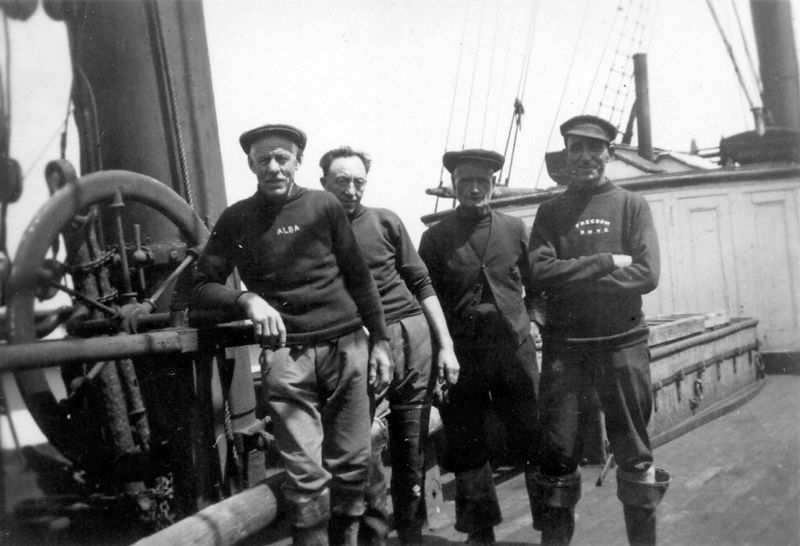 Old Bob South, Ed Wyatt, ?, ? on board the barque ALASTOR - laid up in the River Blackwater. Date uncertain. Date: 1935.