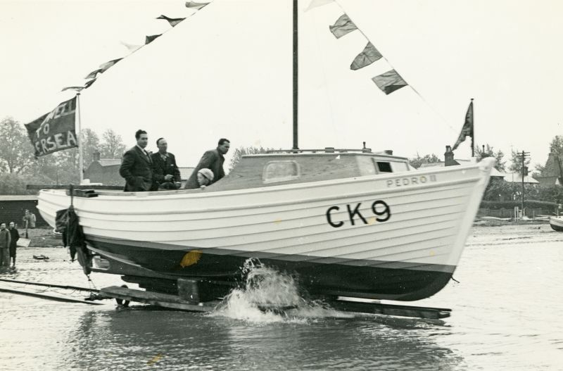 Click to Pause Slide Show


 Launch of Ru Pullen's PEDRO II CK9 at Wyatt's. Ed Wyatt standing in centre of boat. Photograph from Regal Studios, West Mersea.


John Milgate helped build her, along with Jack Emeny. John tells us that the boat had a powerful Chrysler diesel and Rue never liked it as much as the old PEDRO - which he kept on.

 
Cat1 Families-->Pullen Cat2 Ships and Boats-->Launches