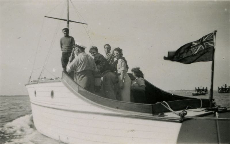 ID AN04_021_013 Boat belonging to Mr Wormell - a garage owner from Sudbury. He is at the wheel. ...