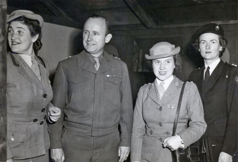  Moira Cockerill née Winch with Red Cross in Italy. Alfred Gruenther, senior US Army Officer, Red Cross President, second from left, Moira on the right.

Previously Moira worked regular shifts at the Mersea First Aid Post.


Mary Kathleen Winch was always known as Moira. Daughter of Howard J. Winch of Empress Avenue, West Mersea. She married Chief Officer Cockerill of the Merchant ...
Cat1 War-->World War 2