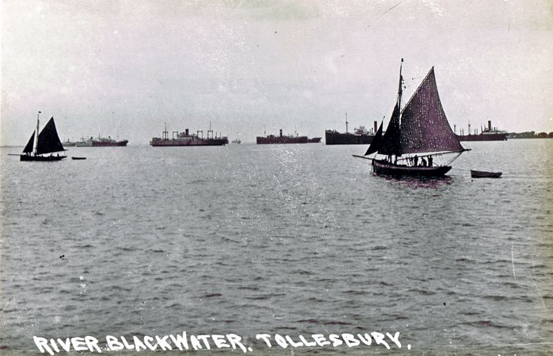 Oyster dredgers and laid up ships in the River Blackwater off Tollesbury. The vessel on the right with engines aft is thought to be the BERWINDLEA which was laid up in the River Blackwater 19 February 1932 to July 1935. Date: c1933.