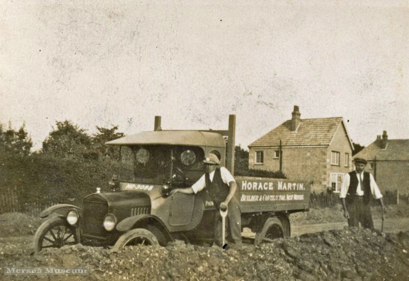  Horace Martin Builder & Contractor, West Mersea. The lorry is left hand drive, registration NO3098. NO.... registrations were issued in Essex 1921/23.

Photograph taken in Seaview Avenue - Charlie Jay in front? 
Cat1 Mersea-->Shops & Businesses Cat2 Transport - buses and carriers