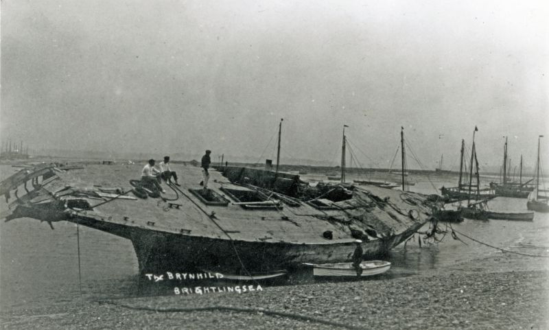  The hulk of the 23 metre racing cutter BRYNHILD, beached in Brightlingsea creek for breaking up, after her dramatic sinking at Harwich in 1910.

Used in The Northseamen page 175.

Used in The Big Class Racing Yachts page 94. 
Cat1 Yachts and yachting-->Sail-->Larger Cat2 Places-->Brightlingsea