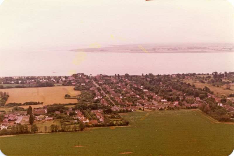  Looking south with East Road across the centre and Seaview Avenue going down to the beach. 
Cat1 Aerial Views-->Mersea
