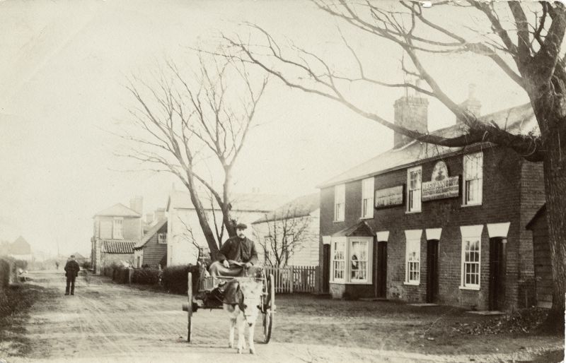  East Road - the Fox in the distance and the old Fountain on the right, now Alpine Cottages. The Fountain licensee is Mary Anne Smith. 
'Cutty' with donkey and cart - the East Mersea Carrier.

Cleghorn postcard. Another copy of this card was mailed September 1905. 
Cat1 Mersea-->Pubs Cat2 Transport - buses and carriers