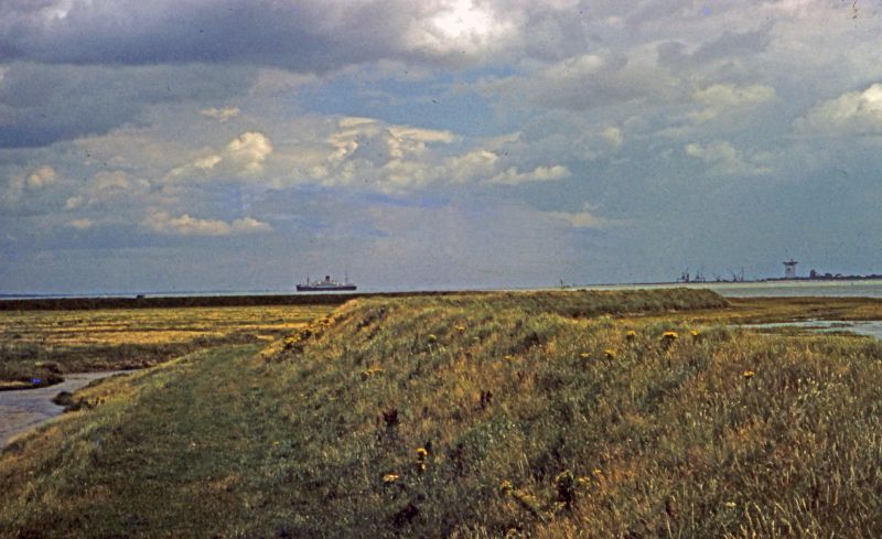  Tollesbury sea wall. Construction work starting at Bradwell power station. GOTHIC laid up in the river.

A 1950s slide taken by Mary Sime. 
Cat1 Tollesbury-->River Blackwater Cat2 Places-->Bradwell Cat3 Blackwater-->Laid up ships