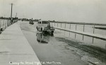 101. ID MM2013_MEA_033 Crossing the Strood, High Tide, West Mersea. 
Car DLB608.
Postcard mailed 31 December 1938 to Mrs Mears, Ivy House, East Mersea, from Hilda K. Page, ...
Cat1 Mersea-->Strood