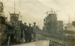 27. ID PBIB_NAV_423 Royal Navy seamen aboard a submarine. To the right are submarines U117, UB148 and AK1.
Photograph thought to be taken at Harwich between November 1918 and May ...
Cat1 Ships and Boats-->Naval Cat2 Places-->Harwich Cat3 Places-->Harwich
