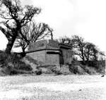  World War 2 Battery Observation Post at Cudmore Grove. It was the observation post for the Coastal Artillery battery located here in WW2. Erosion has since resulted in the building collapsing onto the beach and slowly disintegrating.
 Photo from Essex Record Office, SMR / EHER 10029 (database no longer exists)  IA01_WW2_003