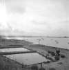 7. ID ATK_035 Ted Woolf oyster pits on Coast Road - just visible distant left is the laid up ship PHILOCTETES, which was in the Blackwater June 1946 to April 1948
Cat1 Mersea-->Coast Road Cat2 Oysters-->Pictures