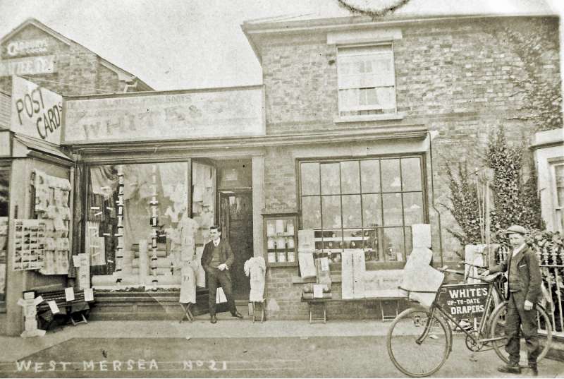 7. ID ALS_WHI_047 White's shop in Church Road. The bicycle on the right says White's up to date drapers. Postcard franked 18 September 1909.
Cat1 Mersea-->Shops & Businesses
