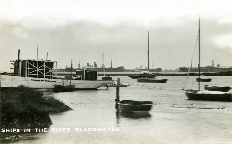 Ships in the River Blackwater, taken from Bradwell.
The vessel on the right is BENGUELA, broken up September 1933. 
There are two Houlder Bros vessels in the picture - they look identical. One is possibly the ORANGE RIVER, which was laid up in the Blackwater December 1932 [T&M Oyster Company records] Date: Before September 1933.