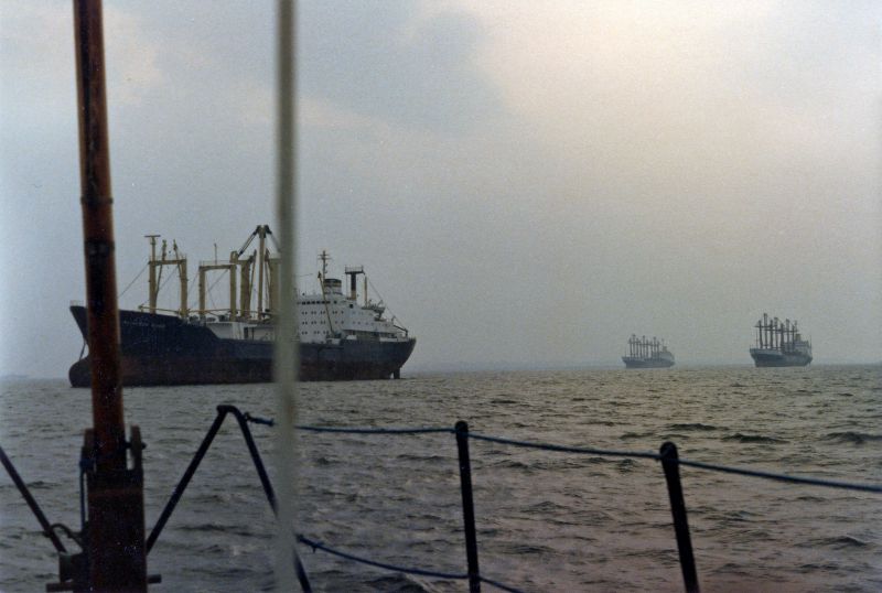 Ships laid up in the River Blackwater. ALIAKMON RIVER on the left, with SAPELE and SOKOTO in the distance. SOKOTO was in the river 1 August 1984 to 15 September 1984, helping date the photograph. Date: cSeptember 1984.