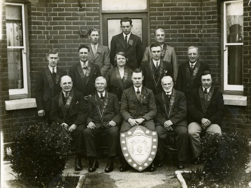  West Mersea Foresters

Court Sailors' Home, No. 5105, AOF

Holders of the Colchester District Challenge Shield, 1931, 1934 and 1935, for the highest aggregate of new members during the year.

Front Row L-R Bros. 1. Albert Wm. Cutts, 2. John French, 3. Wesley V. Chatters, 4. John Wm. Pullen, Herbert Geo. Burgess.

Second Row 1. Aubrey Stoker, 2. Albert G. Greenleaf, 3. Sister ...
Cat1 People-->Other