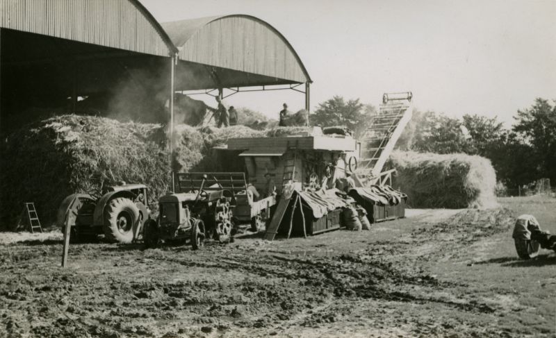  Threshing at Wellhouse Farm in the Summer of 1944, when it was owned by Rosamund and Orson Wright. The tractor on the left is an early Marshall. 
Cat1 Farming