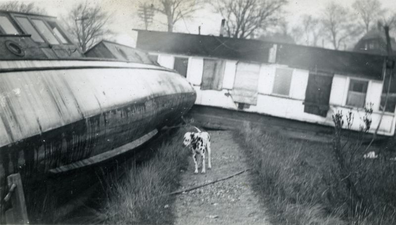  Houseboats after the 1953 flood. SPRAY on the right. The dog is 'Buttons' - lived at the Sailing and Social Club. 
Cat1 Disasters and Mishaps-->on Land Cat2 Mersea-->Houseboats