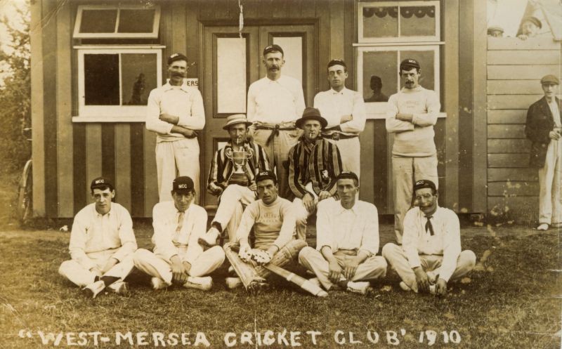  West Mersea Cricket Club in 1910:

Back Row: 1. Tom Mussett, 2. Bill Mussett, 3. Yorrick Mussett, 4. Becky (Manassa) D'Witt.

Middle Row: 1. Roy Littlehales, 2. S.W. Muttingley.

Front Row: 1. Jack Heard, 2. ?, 3. Dick Haward, 4. Titus Mussett, 5. 'Tuddy' Cook.

Extreme right is Fred Sales, father of Reg [Owen Fletcher].

From Two Hundred Not Out, page 15. 
Cat1 People-->Sport