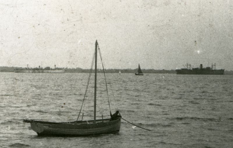 Part of a postcard of West Mersea beach. PHILOCTETES is on the right. Date: c1947.