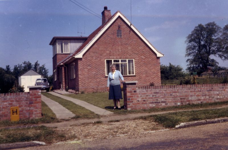  Emily Pullen outside Beeches, now 26 Victory Road. Number 22 next door, where the Ward family eventually lived, is yet to be built. 
Cat1 Families-->Pullen Cat2 Families-->Green Cat3 Mersea-->Buildings