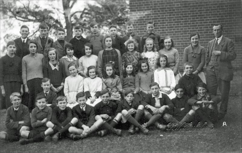  West Mersea School group 

Back row 1. Stanley 'Bump' Farthing,2. Reg Sales, 3., 4., 5. Vic Mussett 

Second row 1., 2. Beat Green, 3, Doris Tucker ?, 4. Emmy Green, 5. Gert French, 6. (one of the Primus Prickers Iris or Mary), 7. David Vince's Mum, 8. Gladys Hempstead (Mrs Albert Clarke) (or Sybil Farthing) 
Third row 1., 2. Molly Fen, 3. Florence Hewes, 4. A. Cook, 5. Evelyn Jay, 6. ...
Cat1 People-->School Cat2 Mersea-->Schools-->Pictures Cat3 Families-->Cornelius