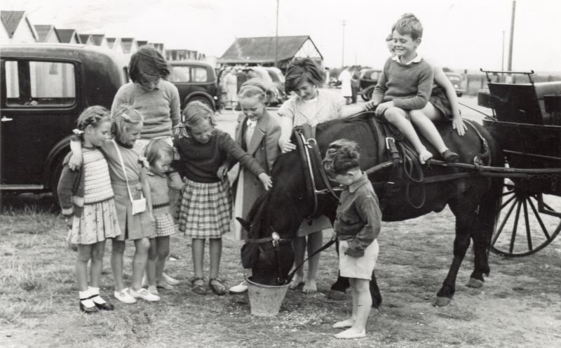  1946, Petrol still rationed. Pony used to bring children to the beach.

Brightlingsea ? 
Cat1 Places-->Brightlingsea Cat2 Transport - buses and carriers