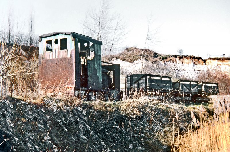  A rare 2'0 gauge 'Resilient' class 4-wheel diesel mechanical locomotive built by John Fowler, Peldon (works number 21295 in 1936). Although the Cliffe works had closed on 1st April 1970, on 24th January 1971 she was still to be found dumped in the quarry near to the connecting tunnel serving the works and was attached to three of the wooden-bodied side tipping wagons. Named Peldon' she is ...
Cat1 Places-->Abberton Cat2 Transport - buses and carriers