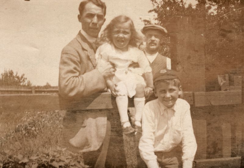  Tom Smith holding Joan Unwin, Preston Smith and Stanley Cooke. 
Cat1 Families-->Smith Cat2 Families-->Cooke