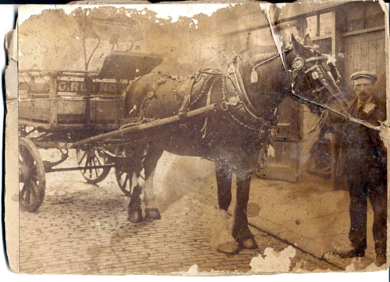  Horse and cart. G. Reynolds on front of cart ? 
Cat1 Transport - buses and carriers