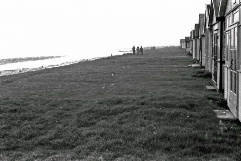  Chalet at Coopers Beach, East Mersea - the Front. The cliff edge has been replaced with sea wall topped with a concrete wall to keep the sea out. The chalets all replaced with caravans.

Photograph by Bill Smith. 
Cat1 Mersea-->Buildings