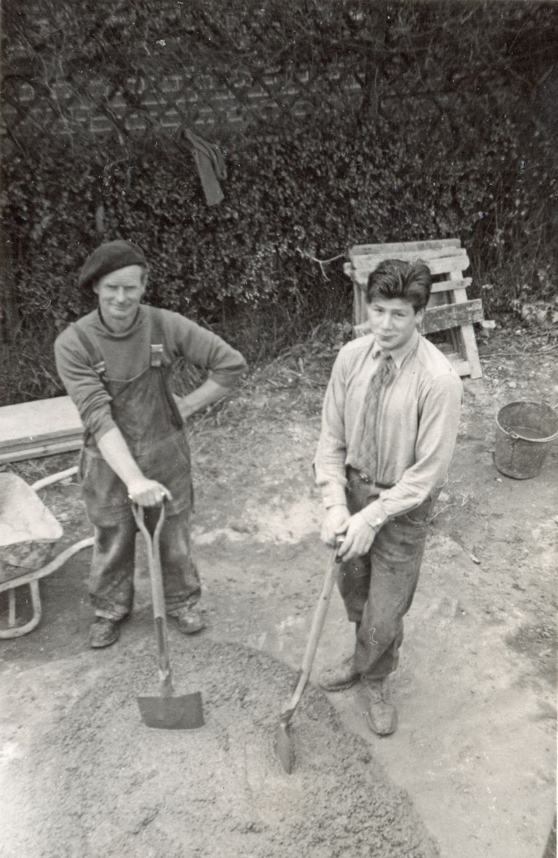  George Milgate and Gordon Russell with a good pile of concrete. Horse in the background for sharpening saws. A metal bucket, not normally seen in in the 21st century. 
Cat1 Families-->Milgate