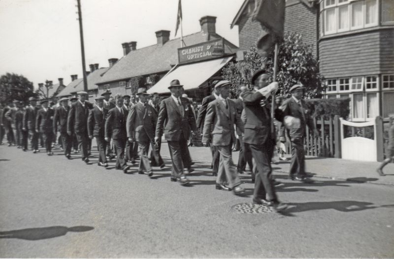  Barfield Road Parade - thought to be for the British Legion County Rally which took place in the School grounds.

Arthur Mills with the banner, Horace Whiting behind him. 
Cat1 Mersea-->Events Cat2 People-->Royal British Legion