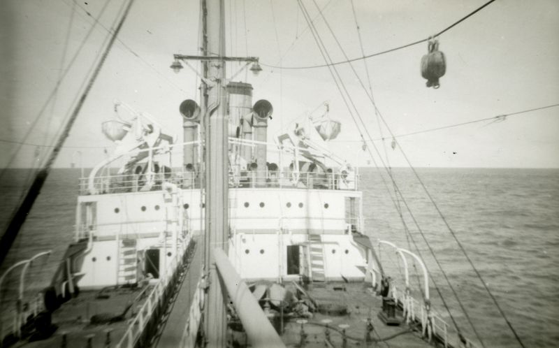 LINGA at sea. A photograph by an apprentice on board, looking aft from the midship accommodation. The tanks are open and the tanks are being cleaned. Photo taken on her trip after leaving the River Blackwater in 1958. Date: c1959.
