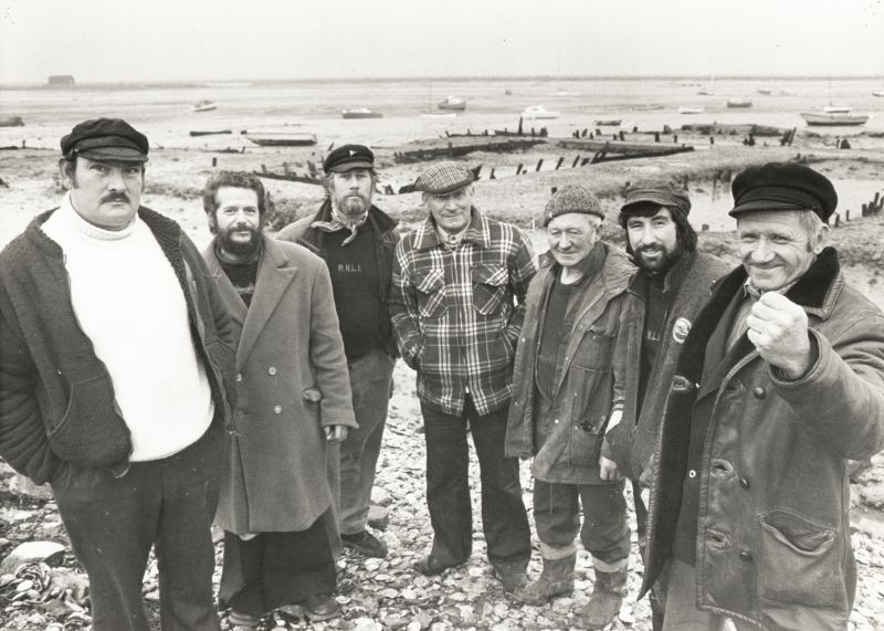 Click to Pause Slide Show


 West Mersea Oystermen pose. L-R Alan Mole, Raymond d'Wit, Douglas Stoker, Bobby Stoker, Lennox Leavett from Tollesbury, Graham Knott, Derek Leavett (had the HELEN & VIOLET).



From Graham Knott Jan 2018: 

The picture was taken by Essex County newspapers for an article by one of their photographers. I think his name was Mike, surname escapes me at moment. I used to socialise with Mike ...
Cat1 People-->Fishermen and Seamen Cat2 Oysters-->Pictures Cat3 Families-->Mole