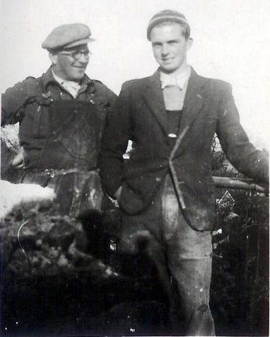  Les Green and his son Ron Green on West Mersea Church tower during repairs in the winter of 1951/52. The photograph was taken by Percy Green.
You can see the gable of Barclay's Bank below Ron's left arm and the rail.

Ron says that an estimate for the church tower repairs of £1,260 was received from Messrs White ( Clifford White ) and accepted. 
Cat1 Families-->Green Cat2 Mersea-->Buildings