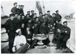 49. ID BF38_001_005_001 The men who won the trophies - crew of the AILSA. Captain Tom Jay with hand on the left hand cup, surrounded by the crew. Bill Wadley is sixth from left in the ...
Cat1 Yachts and yachting-->Sail-->Larger Cat2 People-->Fishermen and Seamen