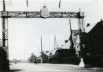24. ID FL09_030_005 1935 Jubilee Arch in Barfield Road. AOF Salutes the Sailor King. Chemist's shop on the right.
From Album 9.
Cat1 Mersea-->Road Scenes Cat2 Mersea-->Events